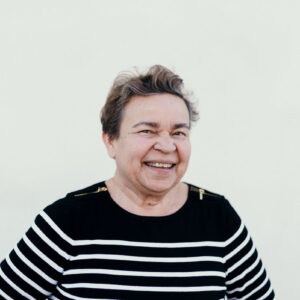 a-beaming-mature-woman-in-a-striped-sweater Πουλόβερ Ριγέ