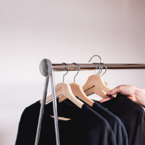 a-hand-removes-a-sweater-from-a-clothing-rack Πουλόβερ 009