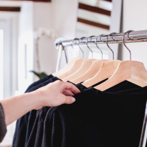 holding-a-sweater-on-a-clothing-rack Πουλόβερ 008