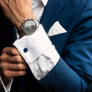 man-adjusts-his-shirt-cuffs-below-watch Πουκάμισο