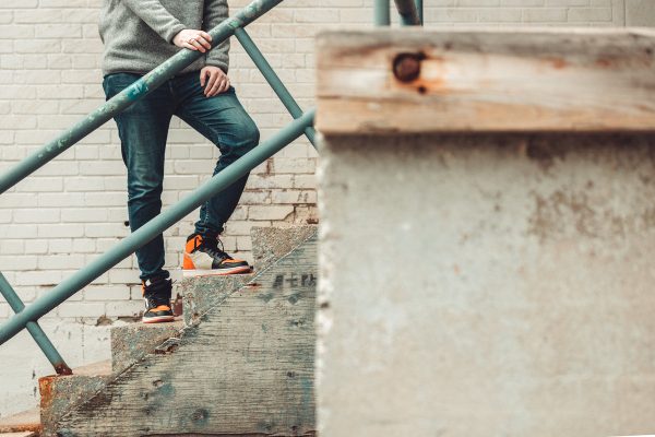 model-poses-on-cement-stairs-in-denim-and-sneakers Sneakers 014